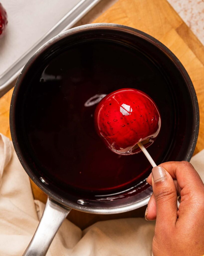 To completely coat before allowing it to drip off and leaving to set. Recipe by movers and bakers