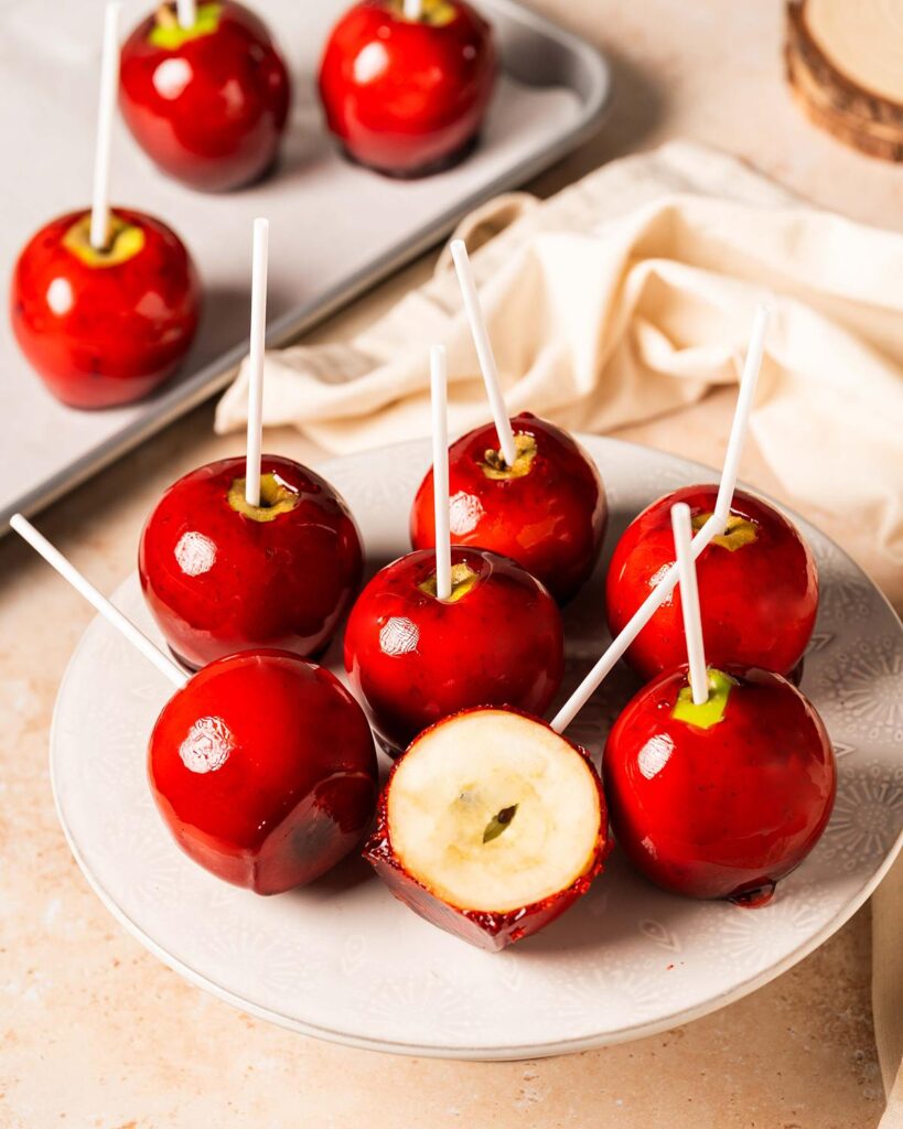My candy apples recipe will bring back all those wonderful nostalgic childhood memories from summer fairs or bonfire night. Crisp juicy apples coated in a crunchy sugar shell, a perfect (slightly healthy!) treat! Recipe by movers and bakers