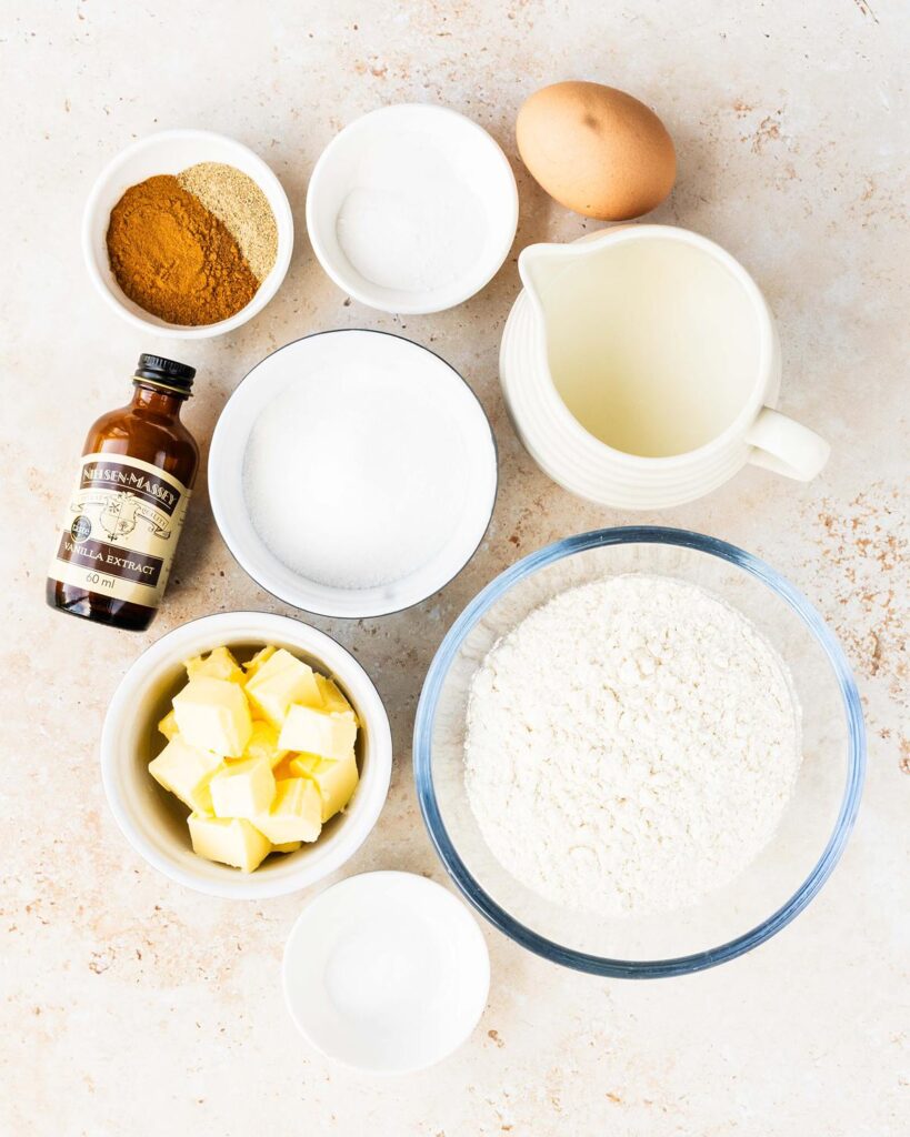 Ingredients for the cake layer: plain (all purpose) flour, caster sugar, baking powder, bicarbonate of soda (baking soda), salt, cinnamon, ground cardamom, buttermilk, vanilla and egg. Recipe by movers and bakers