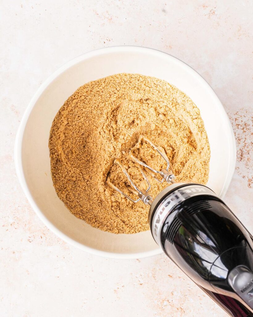 Beat together the dry ingredients and butter until it resembles fine breadcrumbs...