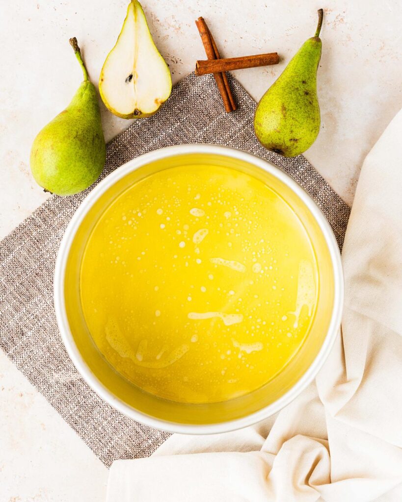 Pour the melted butter into the prepared tin, swirling to completely coat the bottom...