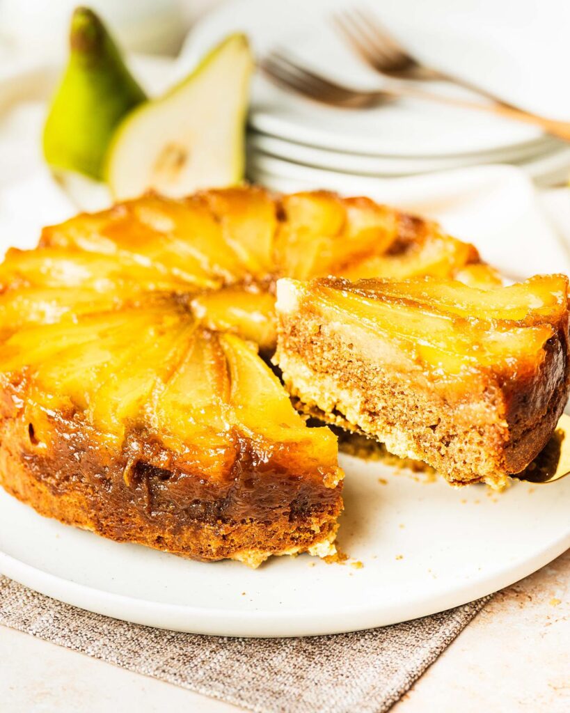 My pear upside down cake makes the most of gorgeous seasonal pears, stunning golden caramel and a lightly spiced cake (with a crumble crunch!) for the ultimate start to autumnal bakes! Recipe by movers and bakers