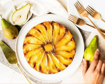 My pear upside down cake makes the most of gorgeous seasonal pears, stunning golden caramel and a lightly spiced cake (with a crumble crunch!) for the ultimate start to autumnal bakes! Recipe by movers and bakers