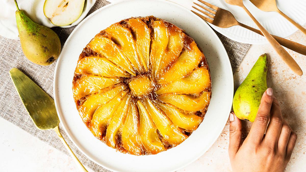 My pear upside down cake makes the most of gorgeous seasonal pears, stunning golden caramel and a lightly spiced cake (with a crumble crunch!) for the ultimate start to autumnal bakes! Recipe by movers and bakers