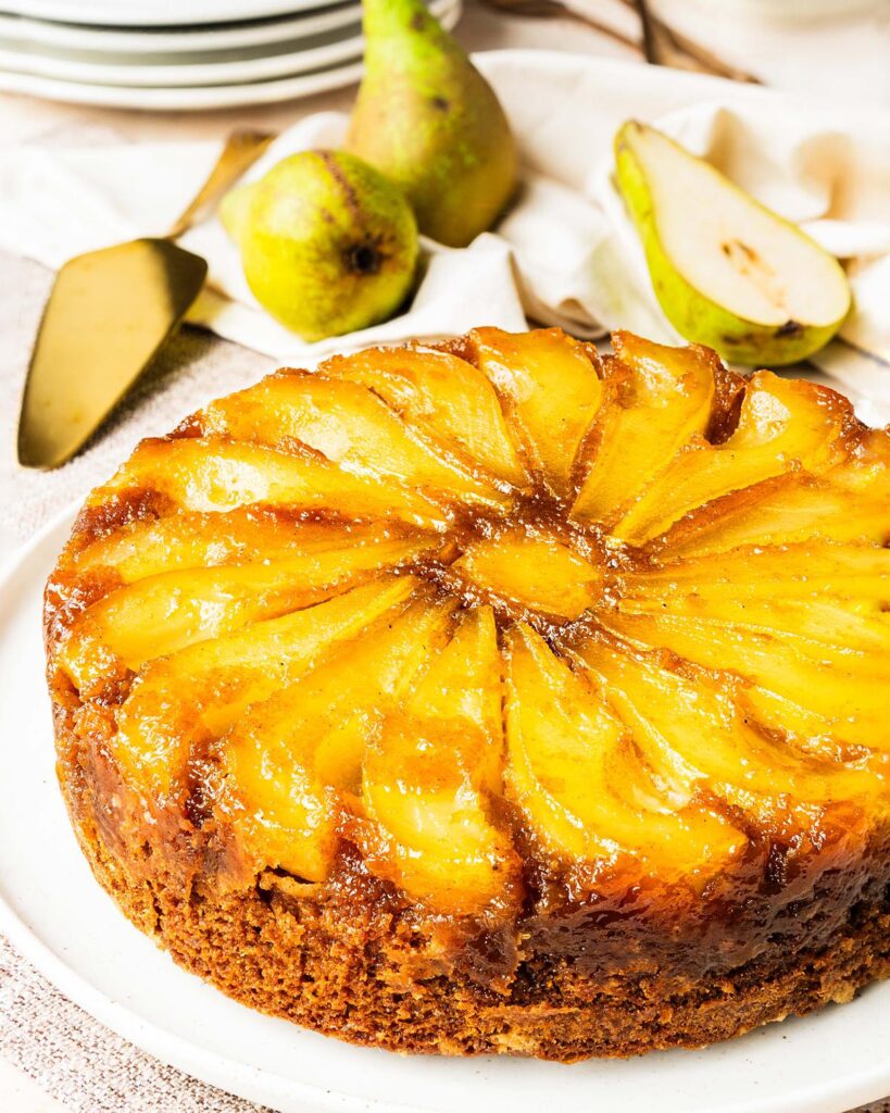 My pear upside down cake makes the most of gorgeous seasonal pears, stunning golden caramel and a lightly spiced cake (with a crumble crunch!) for the ultimate start to autumnal bakes! Recipe by movers and bakers