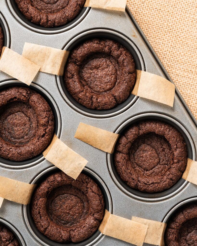 Before baking and pressing the middle down again to form cups. Recipe by movers and bakers