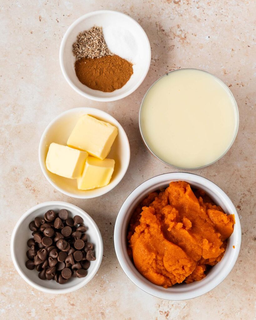 Ingredients required: pumpkin puree, sweetened condensed milk, spices, unsalted butter, demerara sugar (not pictured) and chocolate chips. Recipe by movers and bakers