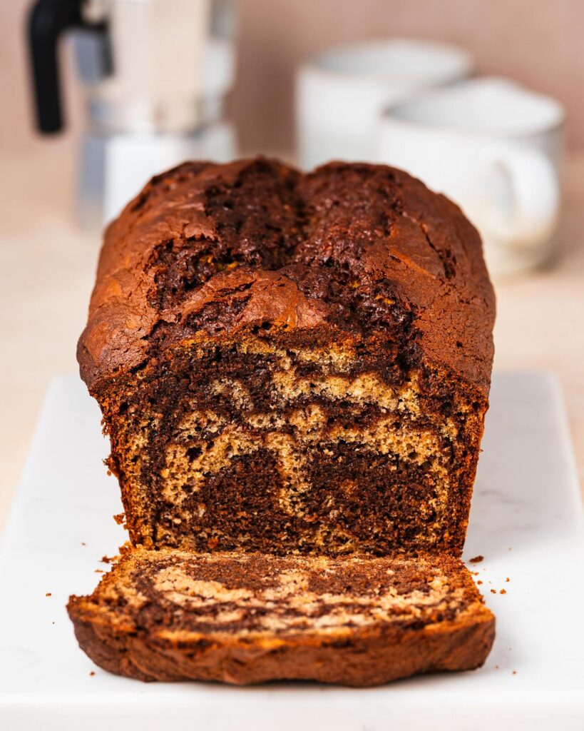 Elevate the classic banana bread with Nutella delectable twist on a classic! Nutella banana bread is the perfect homely bake for any time! Recipe by movers and bakers