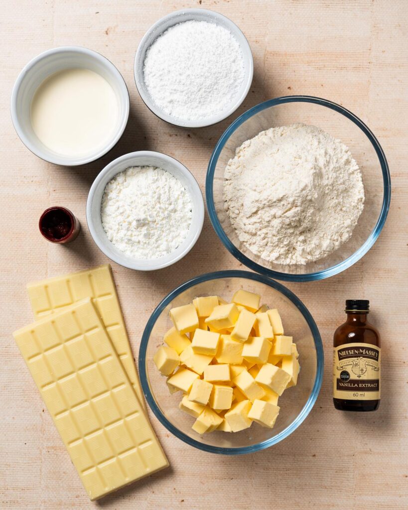 Ingredients required: unsalted butter, icing (powdered sugar), vanilla, plain (all purpose) flour, cornflour (cornstarch), double (heavy) cream and white chocolate. Recipe by movers and bakers