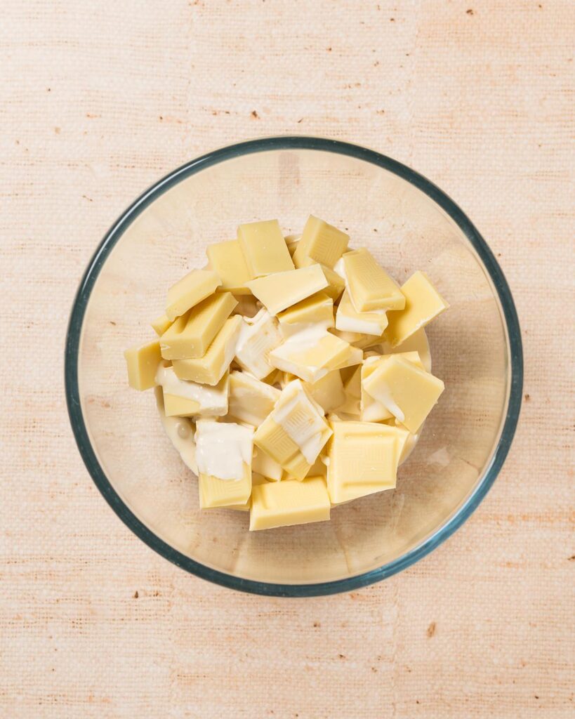 Place the chocolate and cream into a microwave safe bowl, and melt in short bursts...