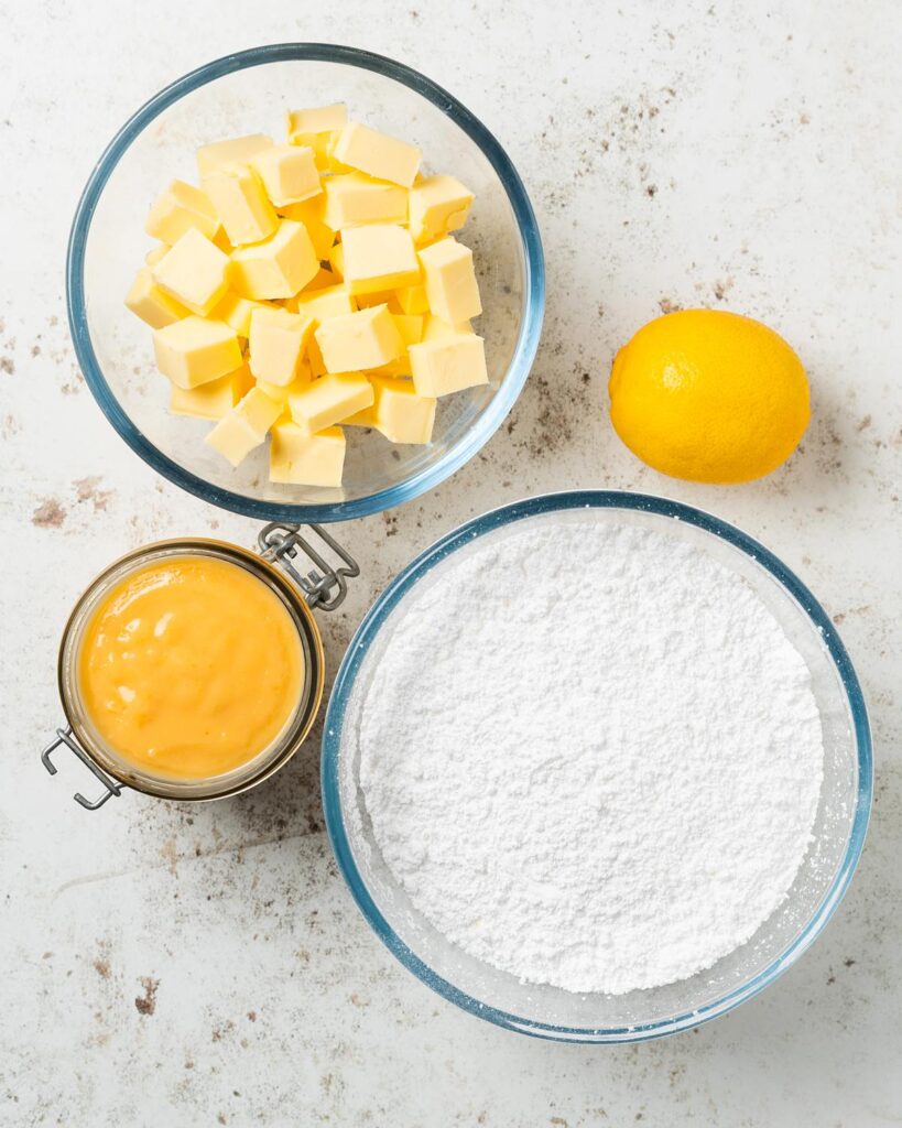 Ingredients for the buttercream and filling: lemon curd, unsalted butter, icing (powdered) sugar and lemon juice. Recipe by movers and bakers