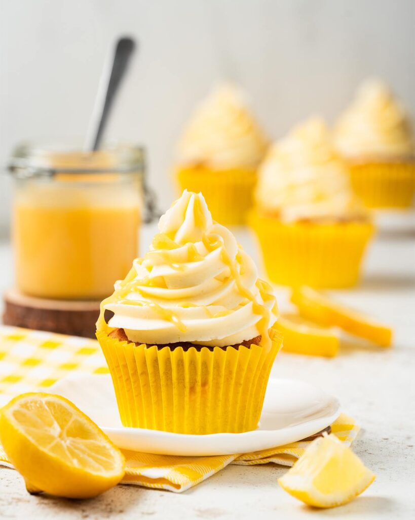 Lemon curd cupcakes. Cram packed with beautiful lemon flavour and curd at every opportunity, these cupcakes are truly a lemon lover's delight! Recipe by movers and bakers