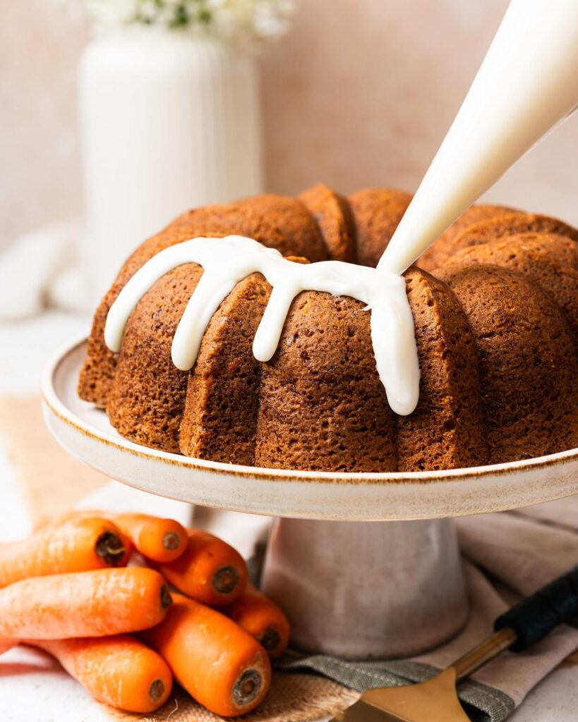 Pipe (or spoon) the prepared cream cheese glaze over the cooled cake...