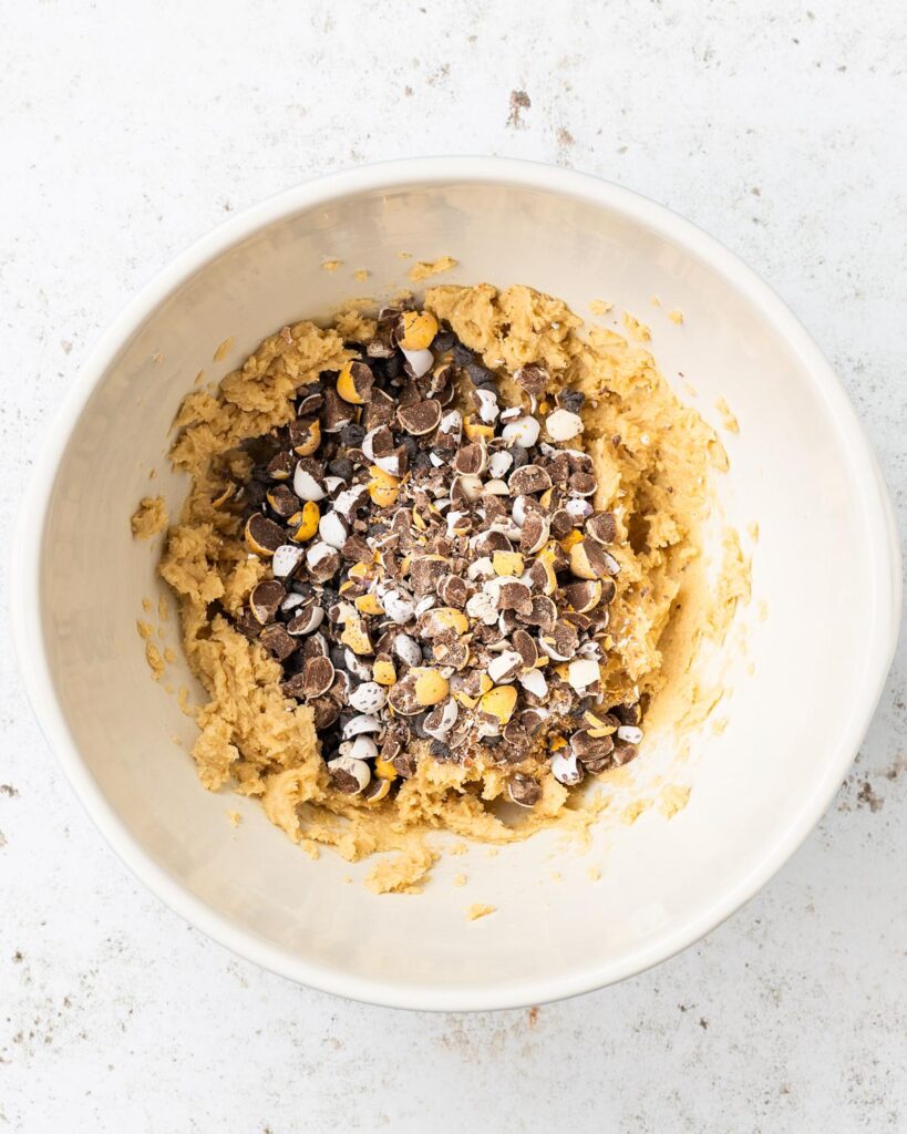 Then tip in the chocolate chips and crushed mini eggs and stir through. Recipe by movers and bakers