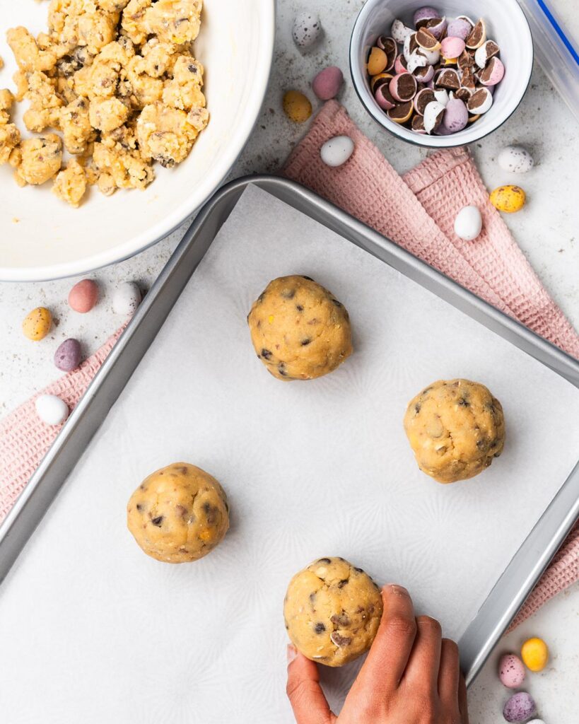 Divide the mixture into eight balls and place on the prepared tray...