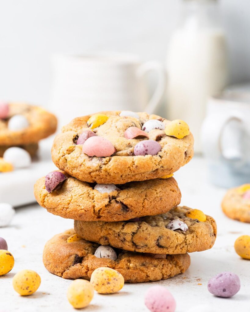 Make the BEST EVER Cadbury's mini egg cookies. They are chunky and chewy, with plenty of dark chocolate chips and mini eggs to keep even the most die hard fan happy! So easy to make, perfect for using up all those extra mini eggs! Recipe by movers and bakers
