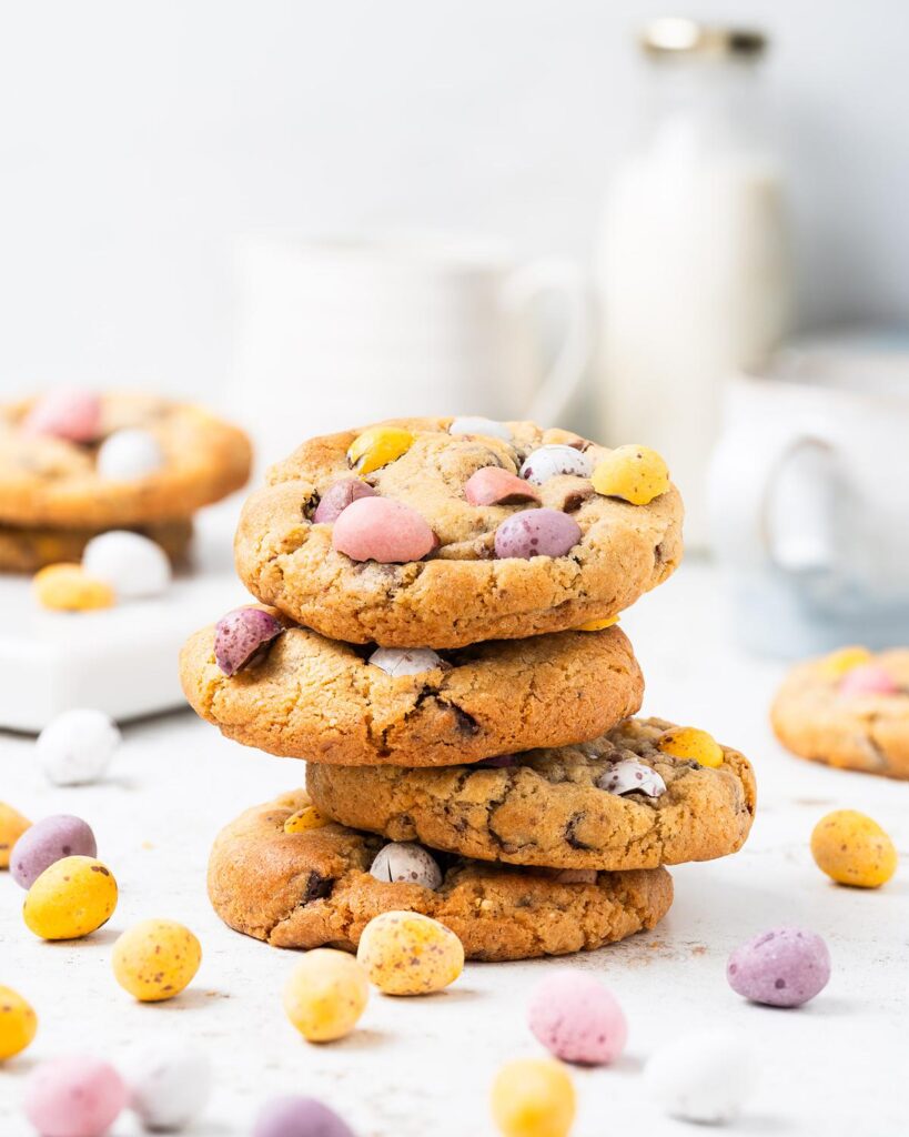 Make the BEST EVER Cadbury's mini egg cookies. They are chunky and chewy, with plenty of dark chocolate chips and mini eggs to keep even the most die hard fan happy! So easy to make, perfect for using up all those extra mini eggs! Recipe by movers and bakers
