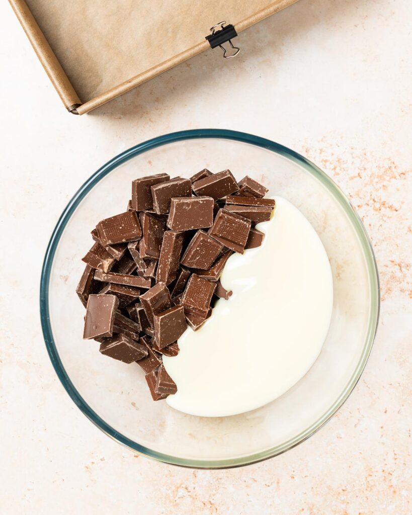 Place the chocolate and condensed milk in a heat proof bowl...