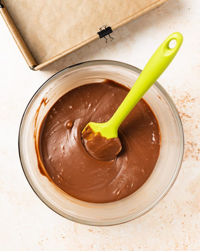 And microwave in bursts, stirring in between, until smooth and melted. Transfer to the prepared tin and level the top. Recipe by movers and bakers