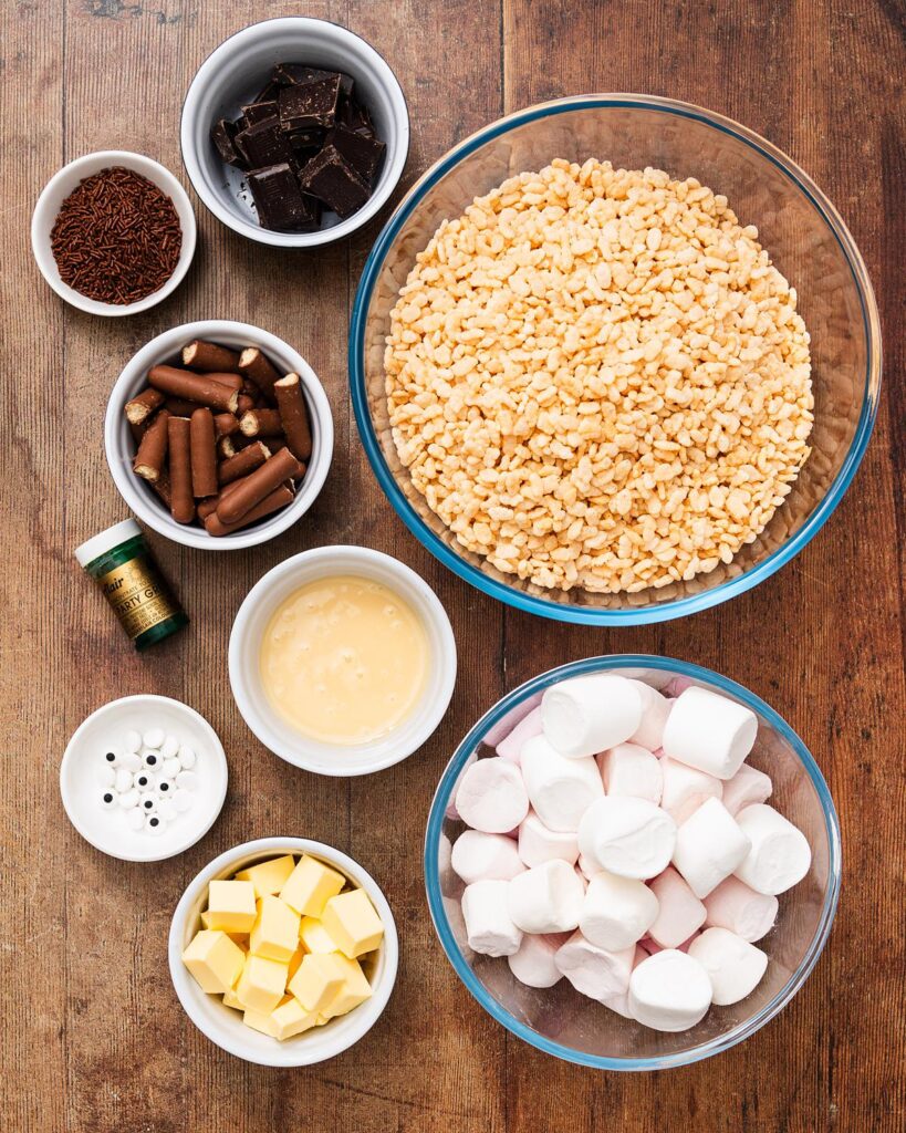 Ingredients required: unsalted butter, condensed milk, marshmallows, green food colouring, rice cereal, dark chocolate, chocolate vermicelli, sugar eyes and chocolate fingers. Recipe by movers and bakers