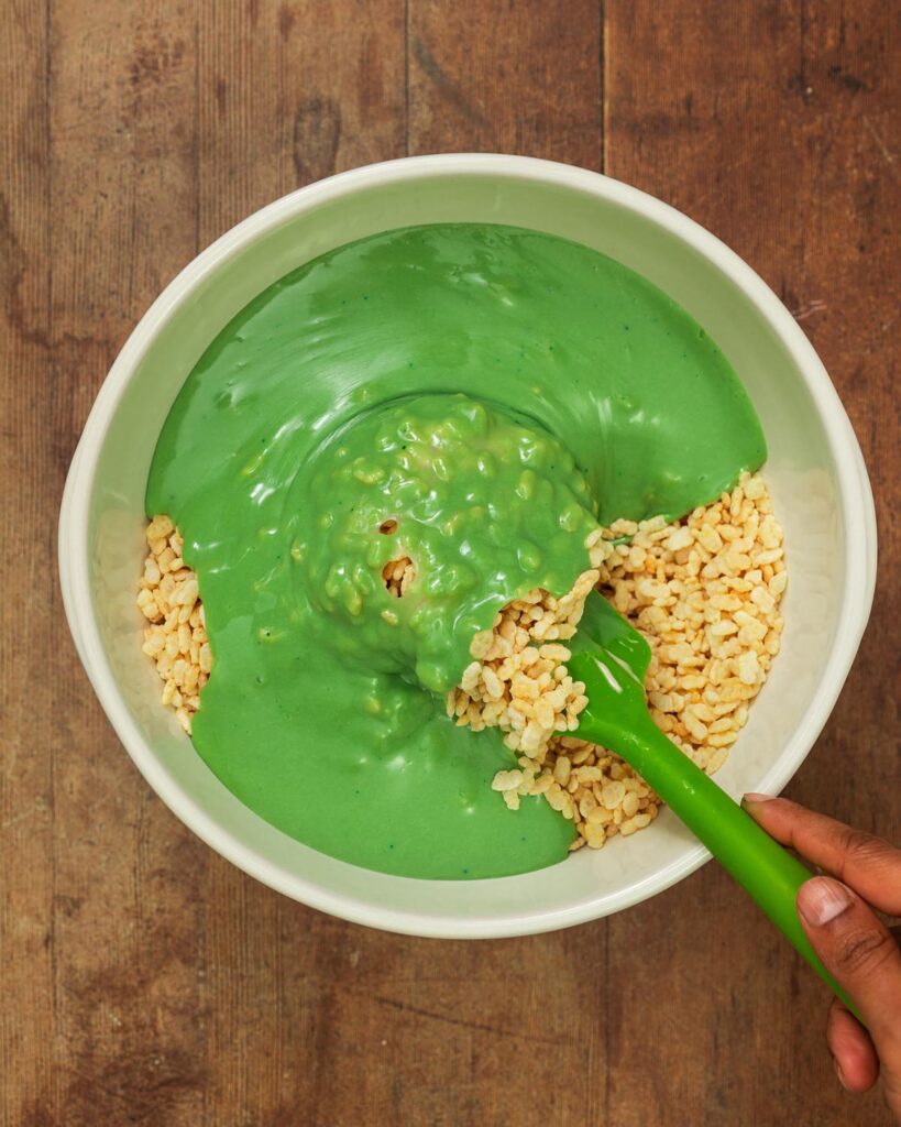 Tip the marshmallow mixture in with the cereal and stir through quickly...