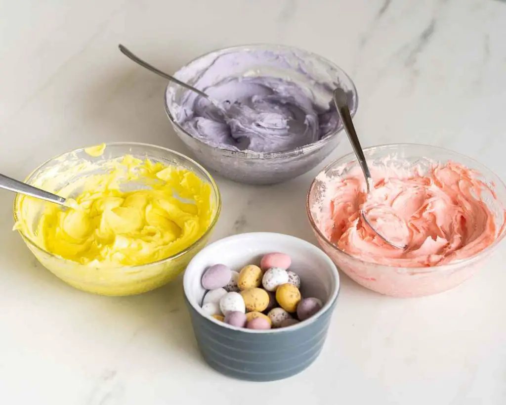 Vanilla buttercream coloured yellow, purple and pink to match Cadbury's mini egg colours. Recipe by movers and bakers