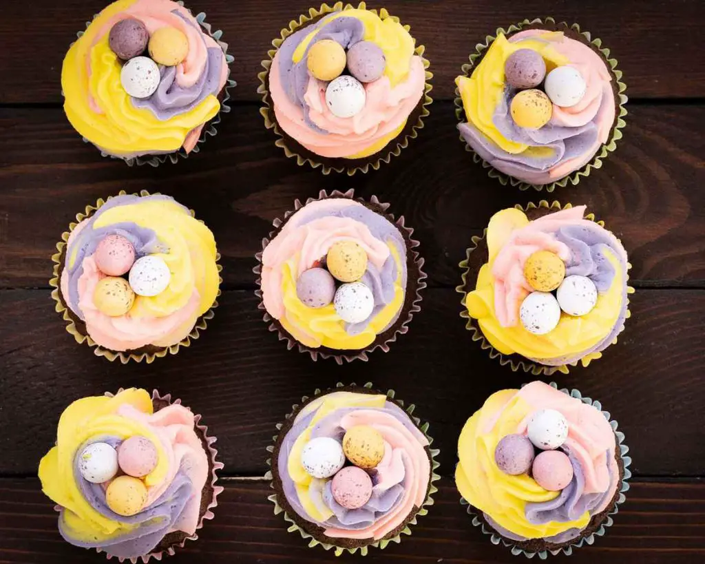 Adorable little mini egg cupcakes arranged in a 3 x 3 square. Recipe by movers and bakers