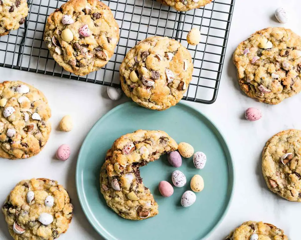 A selection of Cadbury's Mini Egg chocolate chip cookies, inspired by chunky NYC style cookies. Recipe by movers and bakers