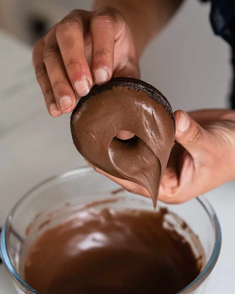 Remember to dip your chocolate fudge doughnuts into the chocolate fudge icing carefully as they are very delicate and can break easily.