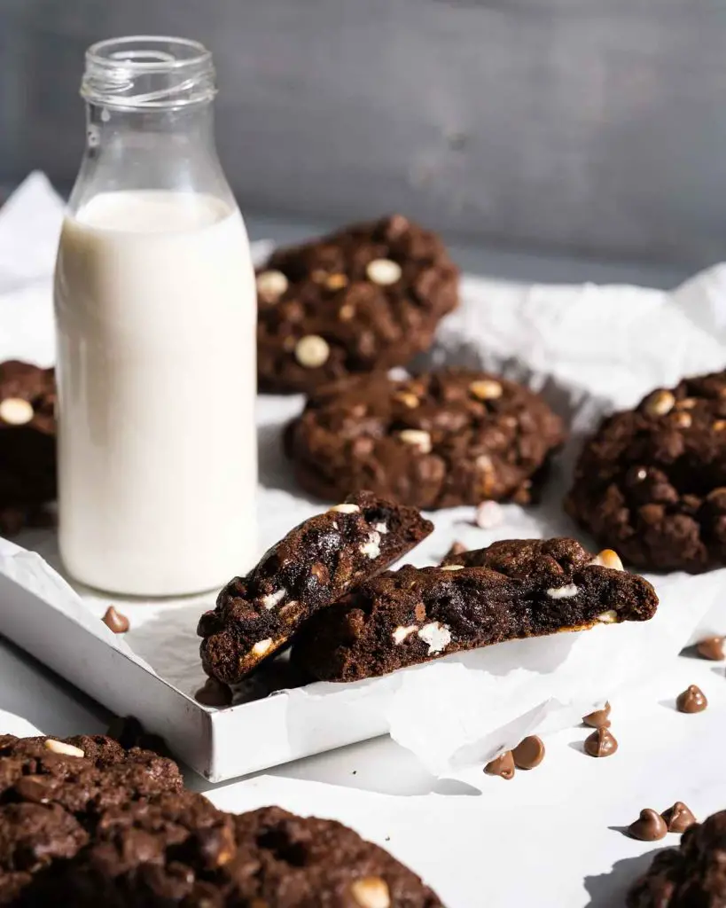 These quadruple chocolate cookies are chunky and chewy and cram packed with lots of beautiful melting chocolate chips. Recipe by movers and bakers