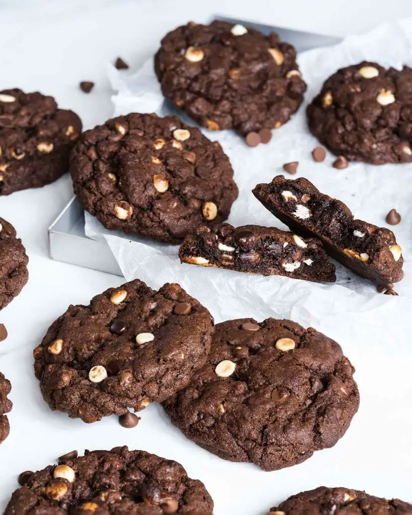 These triple chocolate cookies are chunky and chewy and cram packed with lots of beautiful melting chocolate chips. Recipe by movers and bakers