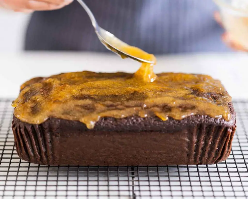 I like to smother my orange chocolate cakes in gorgeous tangy marmalade glaze for extra orange flavour. Yum! Recipe by movers & bakers