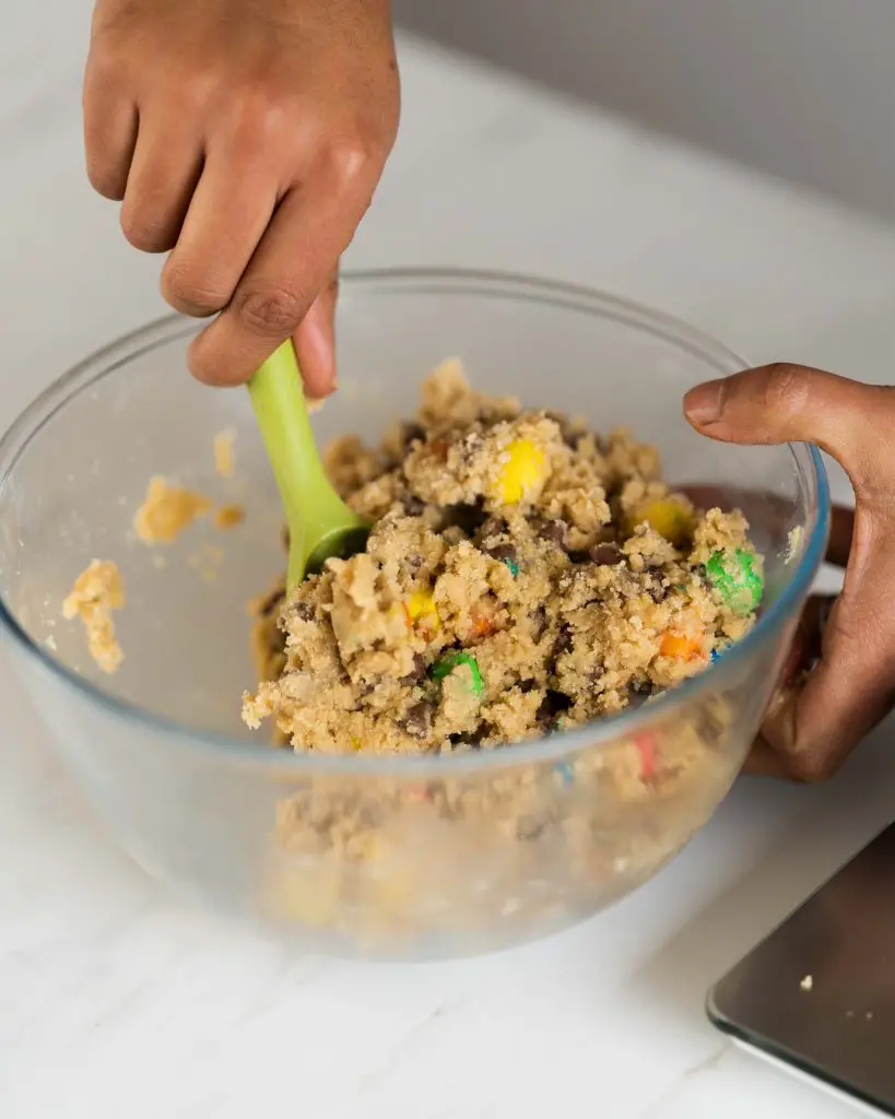 Mixing the M&M cookie dough takes no time at all! Recipe by movers and bakers