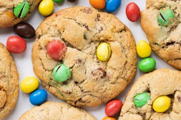 Homemade M&M cookies recipe by movers and bakers. Packed with delicious M&Ms and chocolate chips, these gorgeous cookies are crisp on the outside and wonderfully chewy on the inside. A bright and beautiful treat!