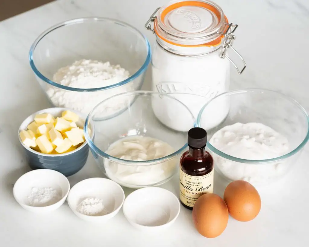 Ingredients required: unsalted butter, caster sugar, plain (all purpose) flour, baking powder, bicarbonate of soda (baking soda), salt, eggs, vanilla and yogurt. Recipe by movers and bakers
