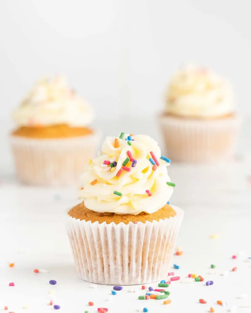 Light fluffy vanilla cupcake with vanilla buttercream and colourful sprinkles