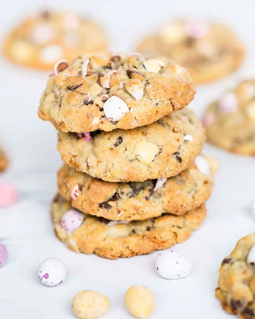 A stack of chunky Mini Egg cookies, inspired by chunky NYC style cookies. Recipe by movers and bakers