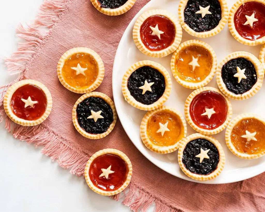 Mini jam tarts. Beautiful buttery shortcrust pastry shells filled with delicious jam. And don't forget the little pastry star! Recipe by movers and bakers