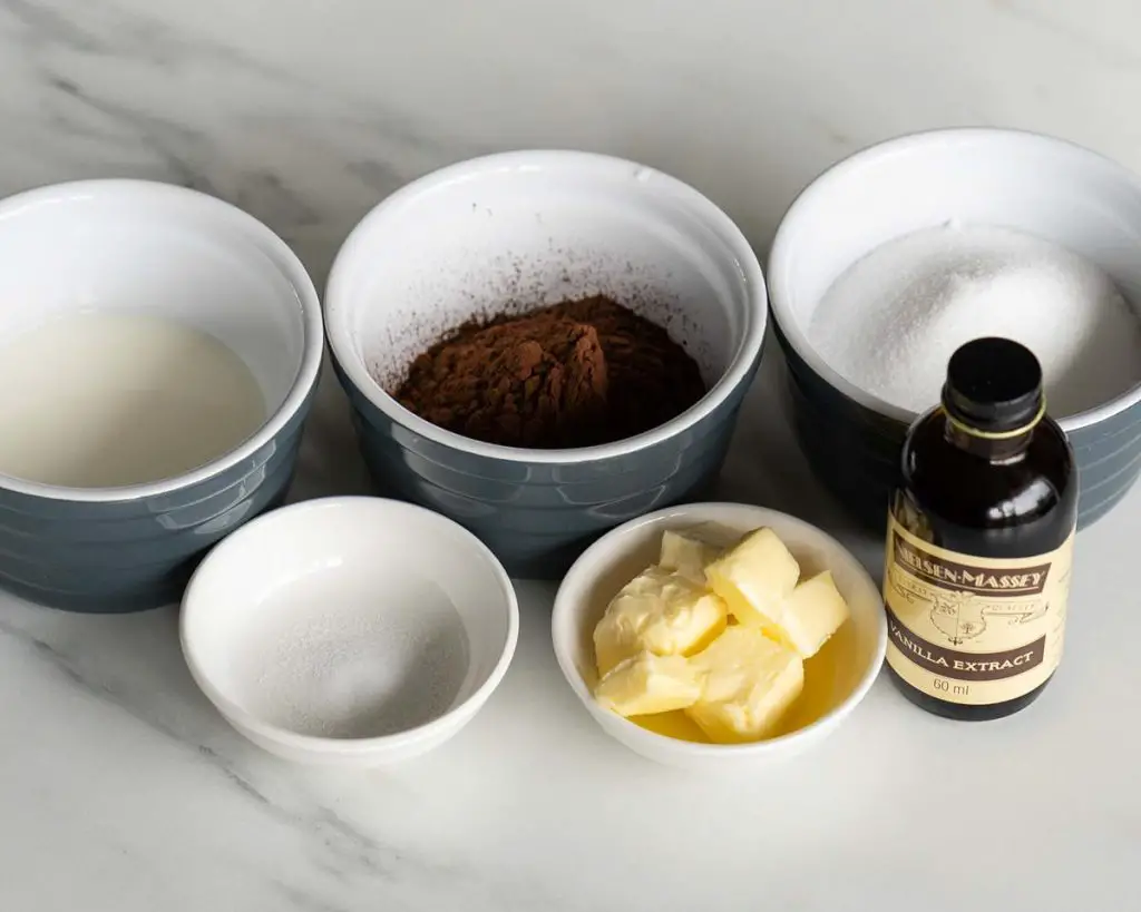 Ingredients for the glaze: unsalted butter, caster sugar, cocoa powder, vanilla, salt and milk. Recipe by movers and bakers