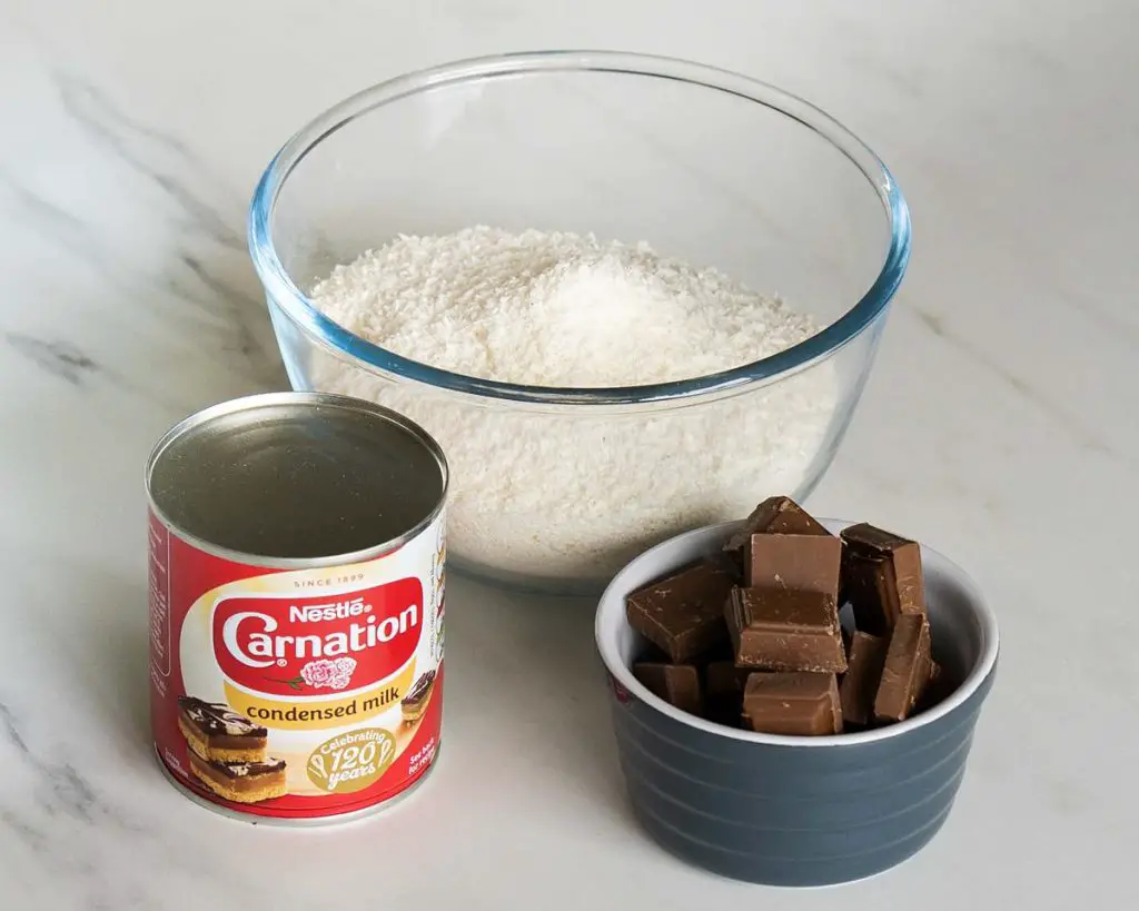 Ingredients needed for this bake: desiccated coconut, condensed milk and chocolate. Recipe by movers and bakers