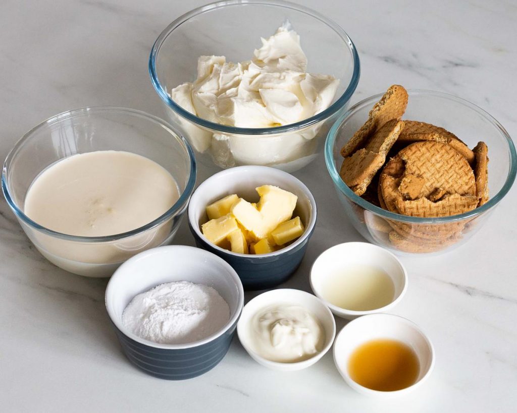 Ingredients for the cheesecake: digestive biscuits, butter, full fat cream cheese, double (heavy) cream, yogurt, lemon juice, vanilla and icing sugar. Recipe by movers and bakers
