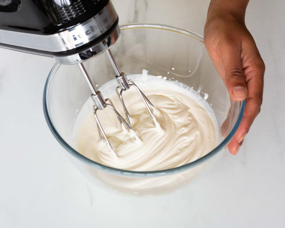 Whip the double (heavy) cream until it reaches stiff peaks. Recipe by movers and bakers