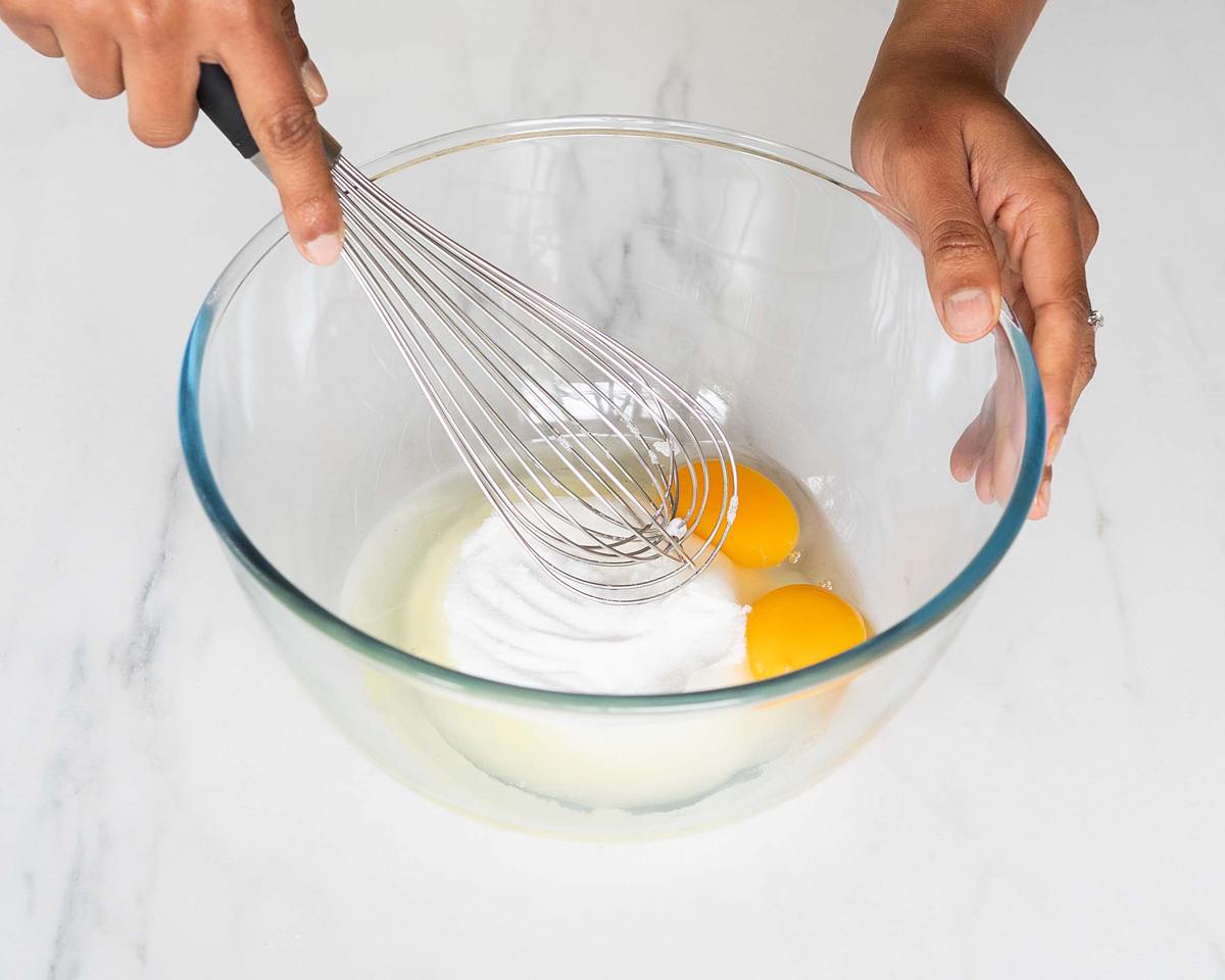 Whisking the eggs and sugar together until pale and creamy. Recipe by movers and bakers