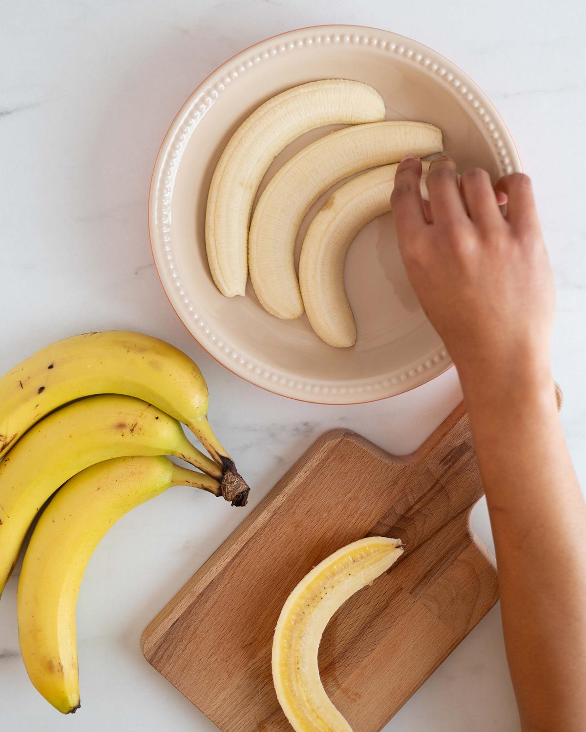Lay the bananas in two even layers in the bottom of the pie dish. Recipe by movers and bakers