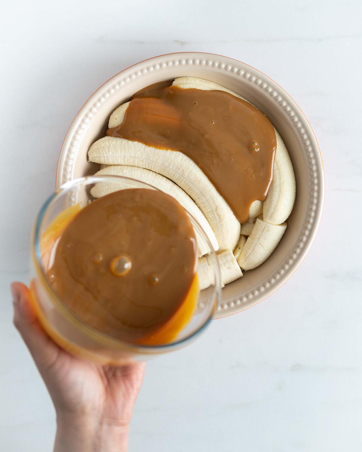 Spread the caramel evenly over the bananas, covering completely. Recipe by movers and bakers