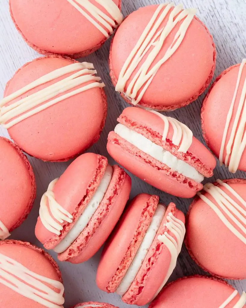 Strawberry macarons. Crisp, chewy, sweet, soft and nutty. And totally irresistible, filled with sweet vanilla buttercream and delicious strawberry jam. Recipe by movers and bakers