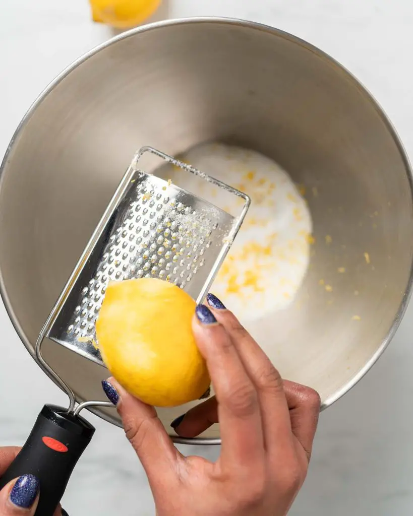Zesting the fruit in with the sugar before mixing in the flavour. Recipe by movers and bakers