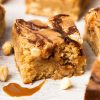 Salted caramel blondies. Soft and fudgy blondies packed with salted caramel, white chocolate chips and hazelnut halves make a delicious mix of flavours and textures! Recipe by movers and bakers