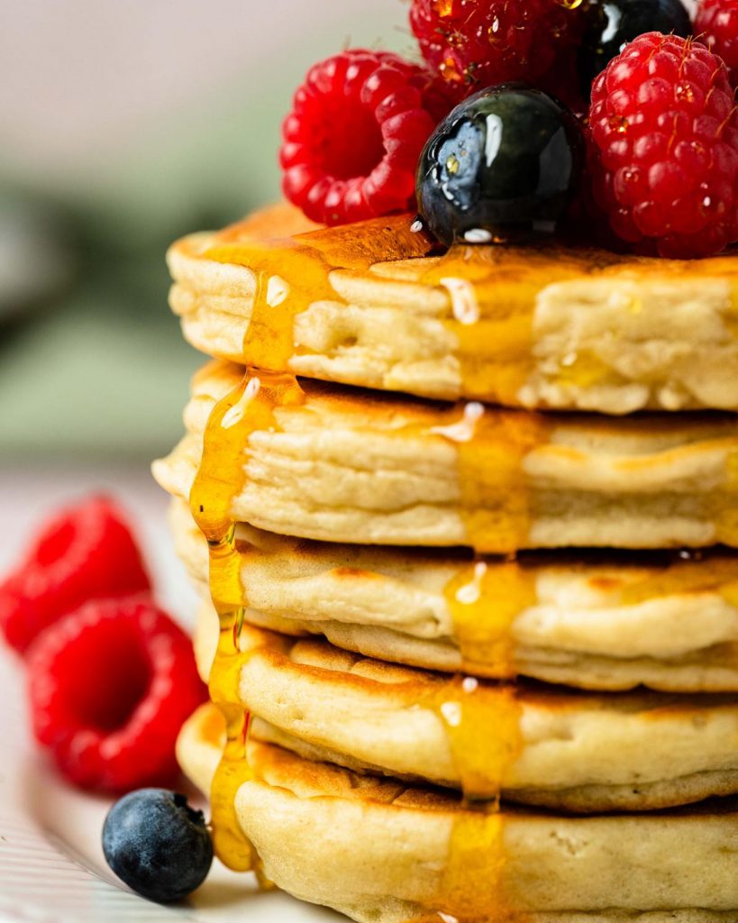 Fluffy American pancakes. These thick beauties are light and fluffy and perfect for lazy brunches or just as an extra special treat! Recipe by movers and bakers